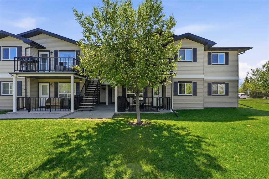 400-8 Bayside Place, Strathmore, AB - Outdoor With Deck Patio Veranda With Facade