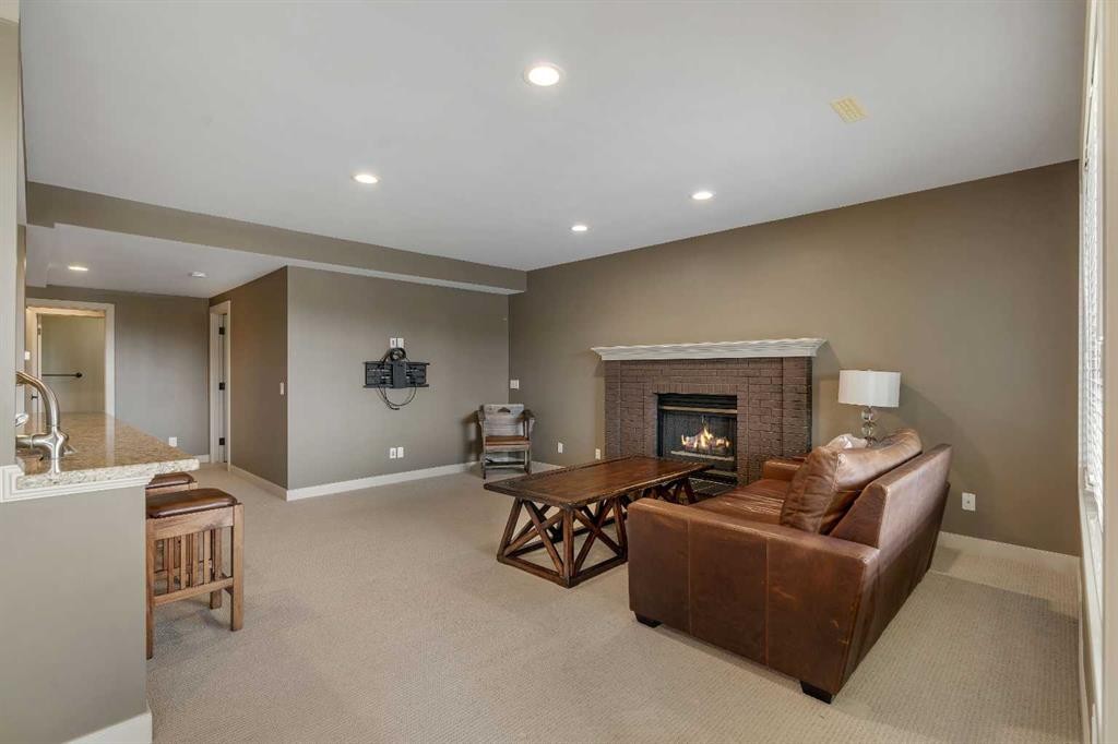 19 Coach Gate Way Sw, Calgary, AB - Indoor With Fireplace