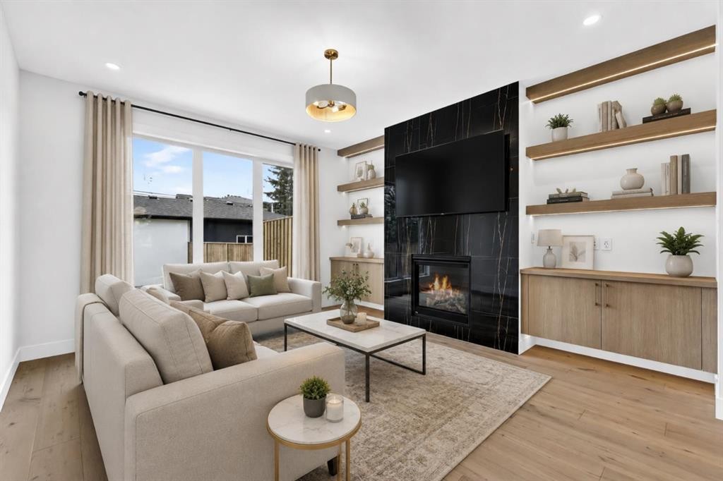 8519 48 Avenue Nw, Calgary, AB - Indoor Photo Showing Living Room With Fireplace