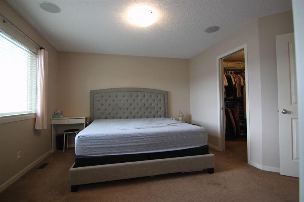 2064 New Brighton Grove Se, Calgary, AB - Indoor Photo Showing Bedroom