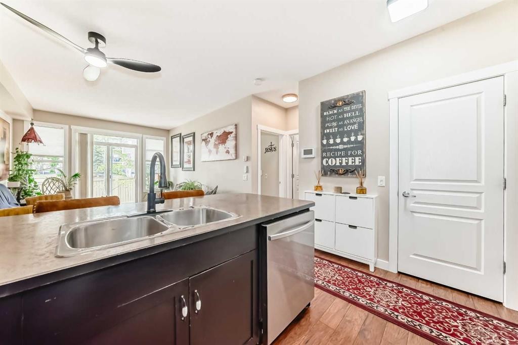 2105-211 Aspen Stone Boulevard Sw, Calgary, AB - Indoor Photo Showing Kitchen With Double Sink