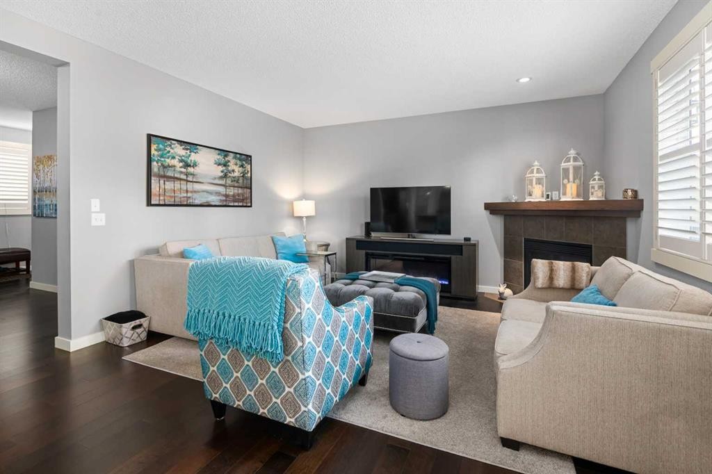 124 Evergreen Circle Sw, Calgary, AB - Indoor Photo Showing Living Room With Fireplace