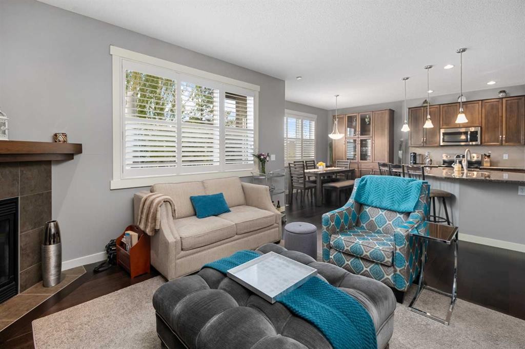 124 Evergreen Circle Sw, Calgary, AB - Indoor Photo Showing Living Room With Fireplace