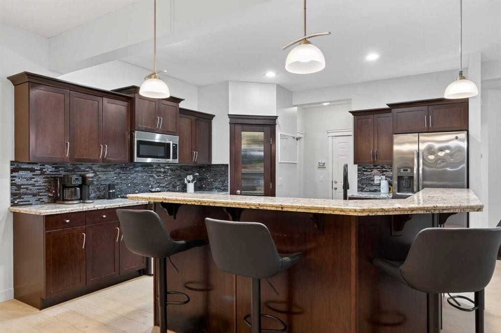 9 Westridge Way, Okotoks, AB - Indoor Photo Showing Kitchen With Upgraded Kitchen