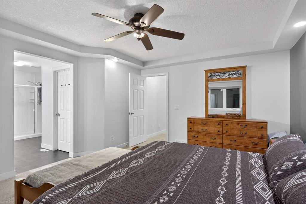 9 Westridge Way, Okotoks, AB - Indoor Photo Showing Bedroom