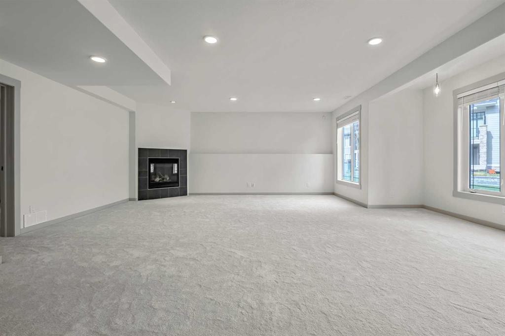 222 Chapala Point Se, Calgary, AB - Indoor Photo Showing Other Room With Fireplace