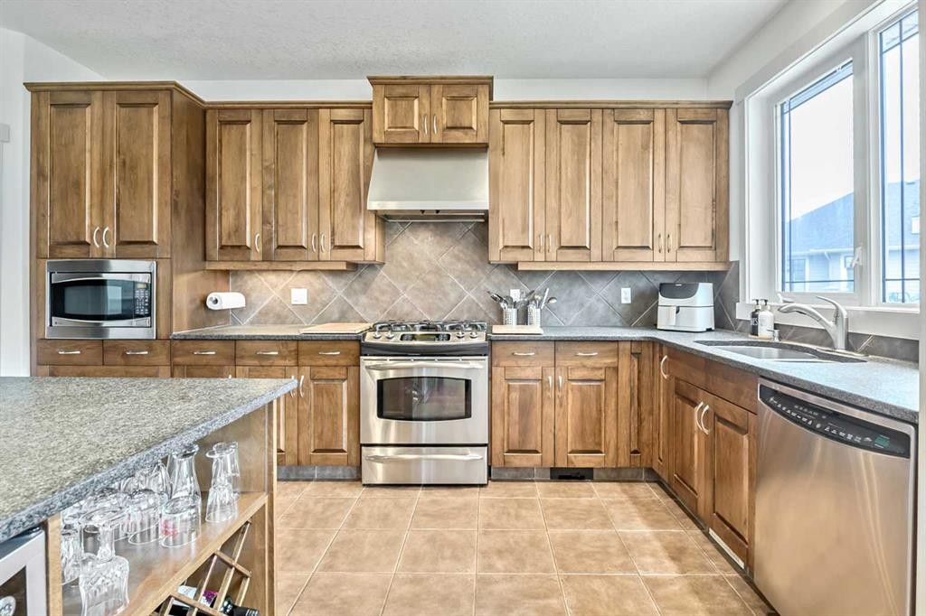 222 Chapala Point Se, Calgary, AB - Indoor Photo Showing Kitchen With Double Sink With Upgraded Kitchen