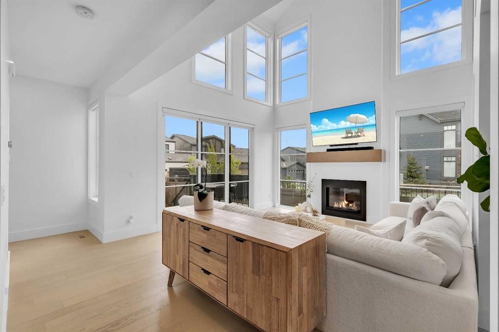 24 Alpine Common Sw, Calgary, AB - Indoor Photo Showing Living Room With Fireplace