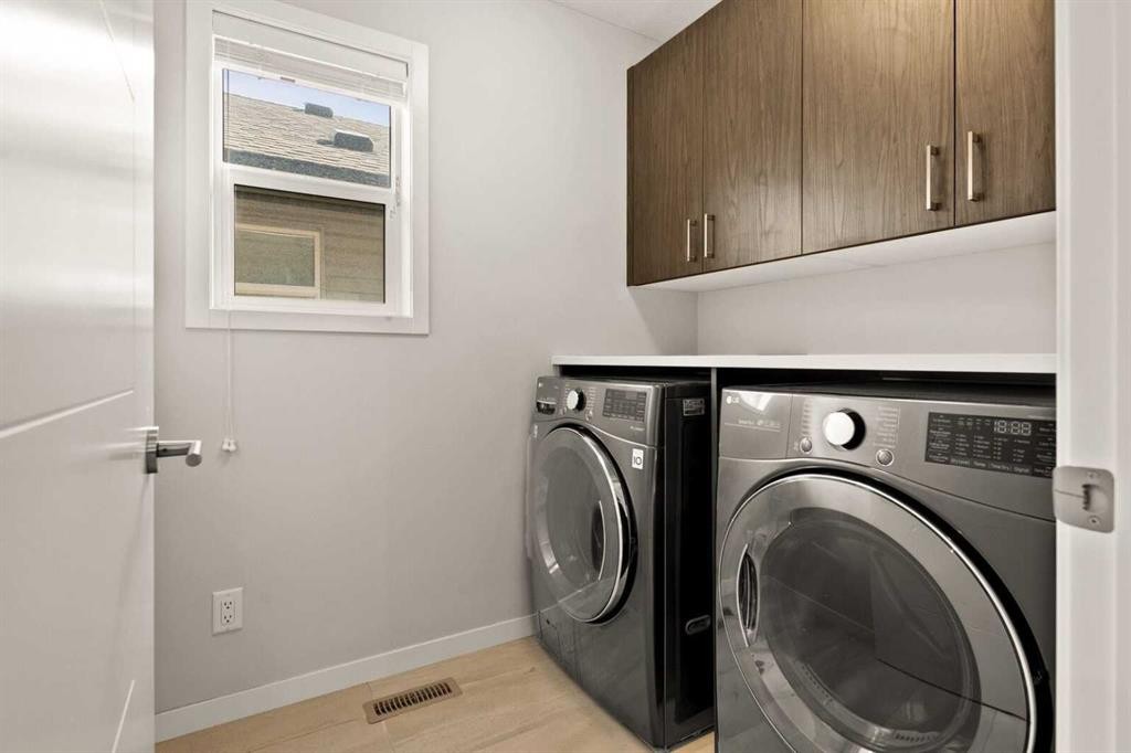 1107 Copperfield Boulevard Se, Calgary, AB - Indoor Photo Showing Laundry Room