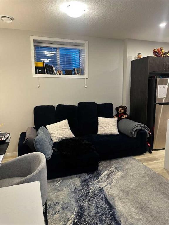 1107 Copperfield Boulevard Se, Calgary, AB - Indoor Photo Showing Living Room