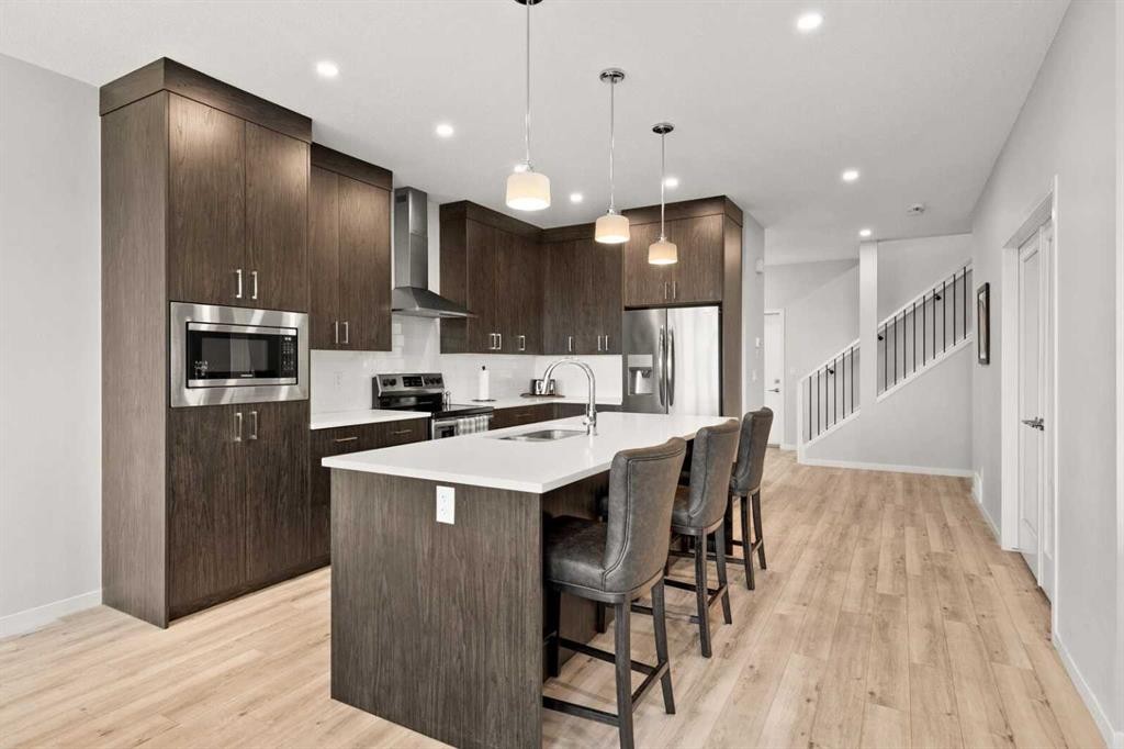 1107 Copperfield Boulevard Se, Calgary, AB - Indoor Photo Showing Kitchen With Stainless Steel Kitchen With Upgraded Kitchen