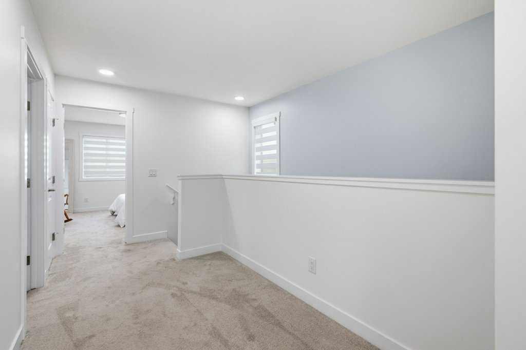55 Heritage Manor, Cochrane, AB - Indoor Photo Showing Other Room