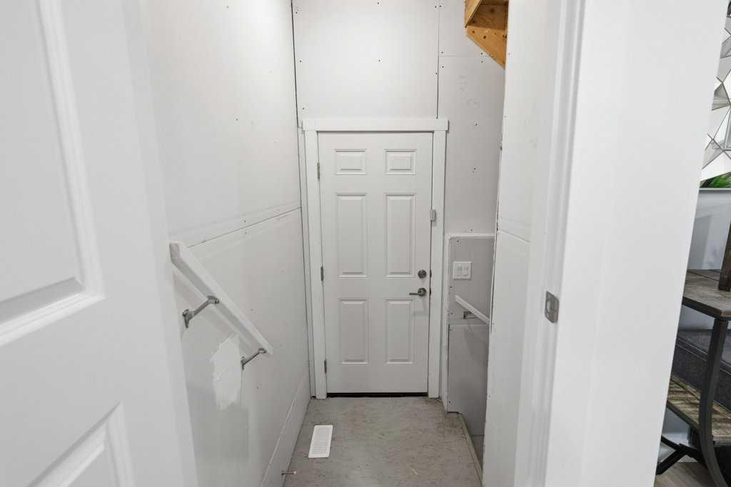 55 Heritage Manor, Cochrane, AB - Indoor Photo Showing Other Room