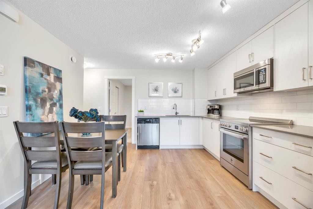 314 Cranbrook Square Se, Calgary, AB - Indoor Photo Showing Kitchen With Upgraded Kitchen