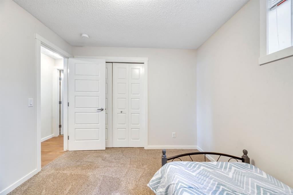 314 Cranbrook Square Se, Calgary, AB - Indoor Photo Showing Bedroom