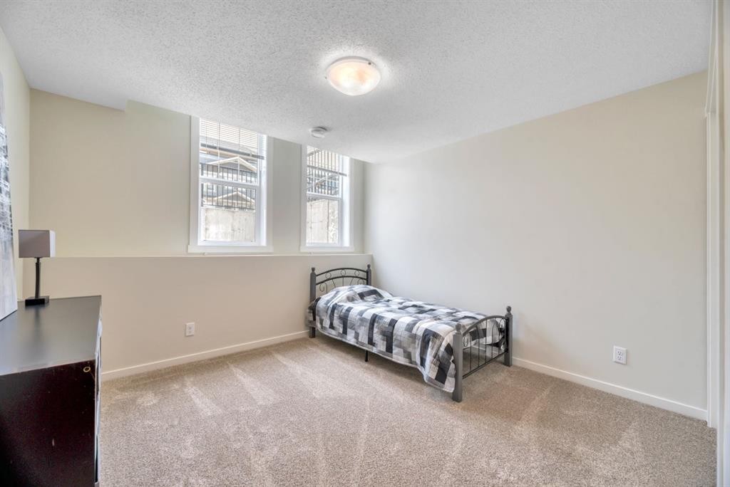314 Cranbrook Square Se, Calgary, AB - Indoor Photo Showing Bedroom