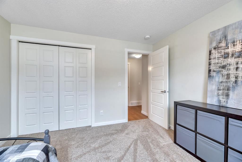 314 Cranbrook Square Se, Calgary, AB - Indoor Photo Showing Bedroom