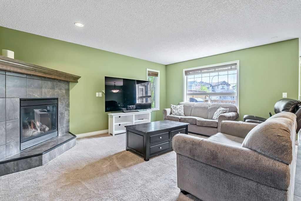 158 New Brighton Lane Se, Calgary, AB - Indoor Photo Showing Living Room With Fireplace