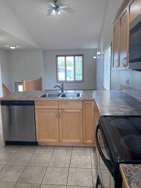 A-4813 49 Street West, Olds, AB - Indoor Photo Showing Kitchen With Double Sink
