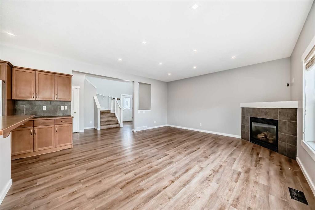 32 Copperleaf Way Se, Calgary, AB - Indoor With Fireplace