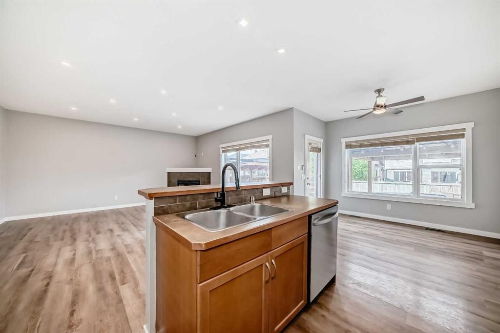 32 Copperleaf Way Se, Calgary, AB - Indoor Photo Showing Kitchen With Double Sink