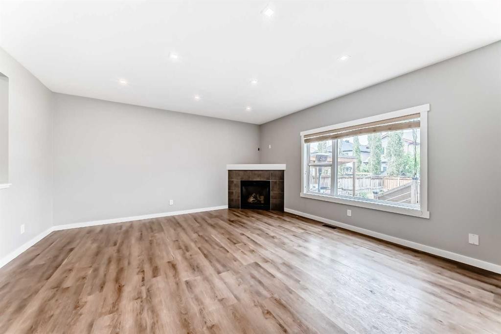 32 Copperleaf Way Se, Calgary, AB - Indoor With Fireplace