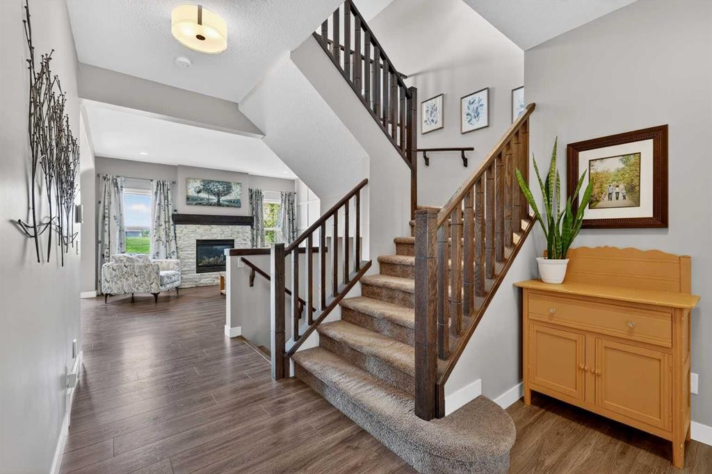 236 Aspenmere Circle, Chestermere, AB - Indoor Photo Showing Other Room With Fireplace