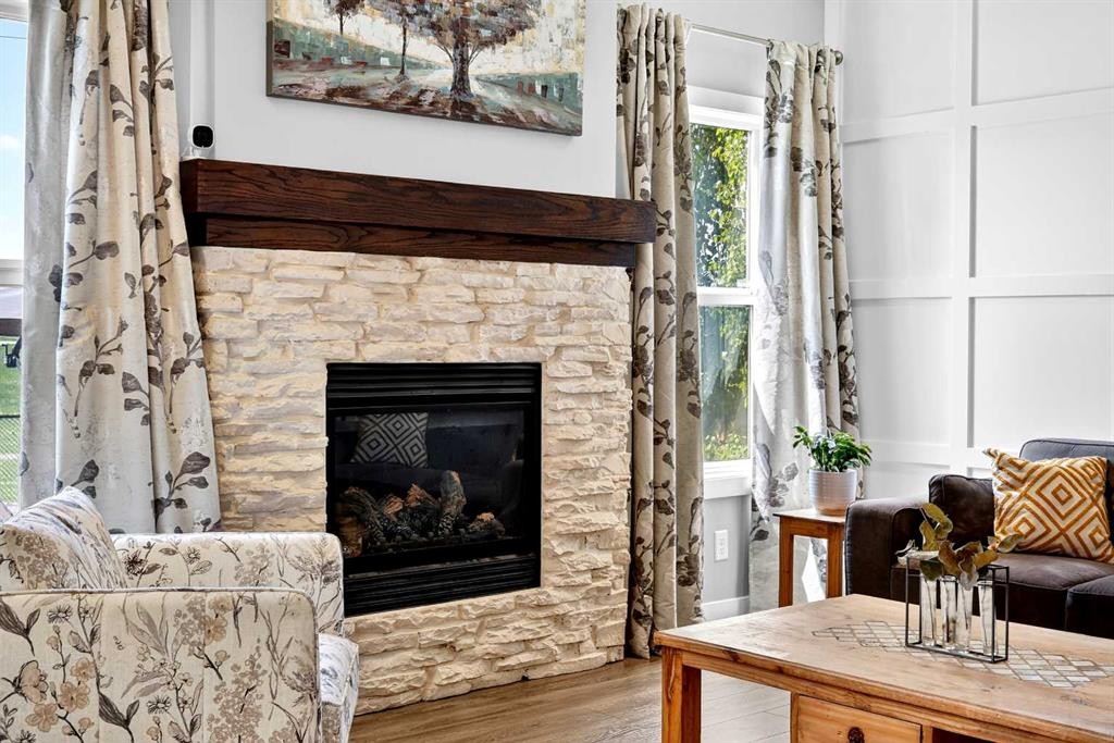 236 Aspenmere Circle, Chestermere, AB - Indoor Photo Showing Living Room With Fireplace