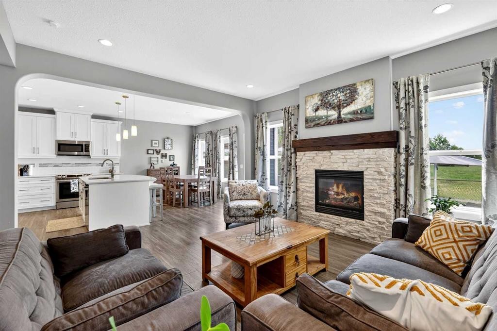 236 Aspenmere Circle, Chestermere, AB - Indoor Photo Showing Living Room With Fireplace