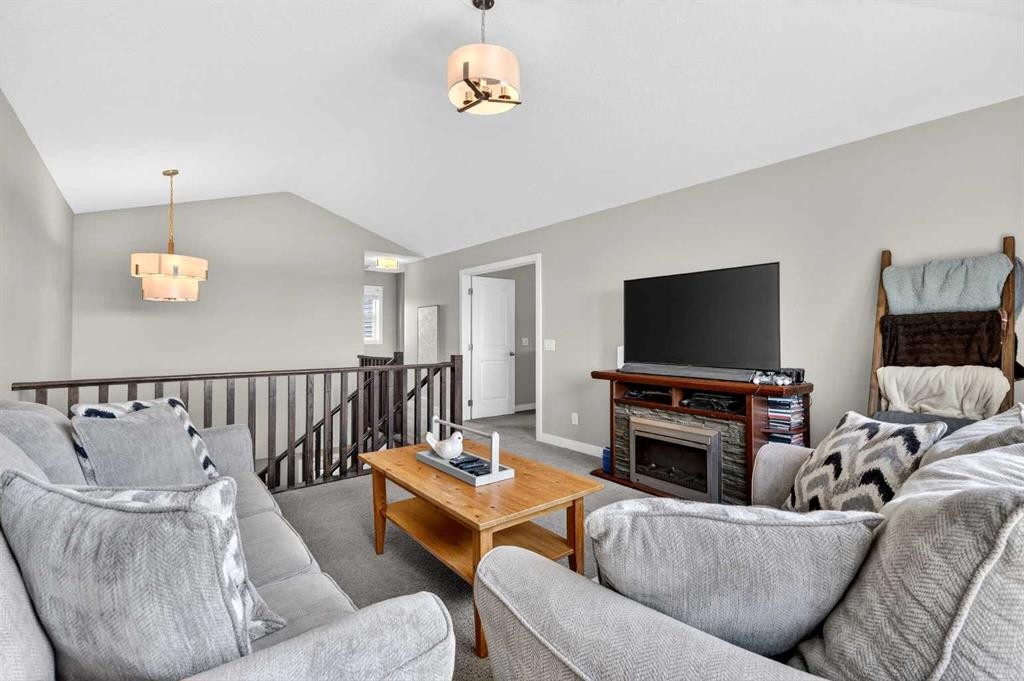 236 Aspenmere Circle, Chestermere, AB - Indoor Photo Showing Living Room With Fireplace