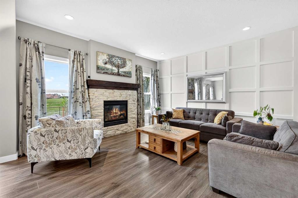 236 Aspenmere Circle, Chestermere, AB - Indoor Photo Showing Living Room With Fireplace