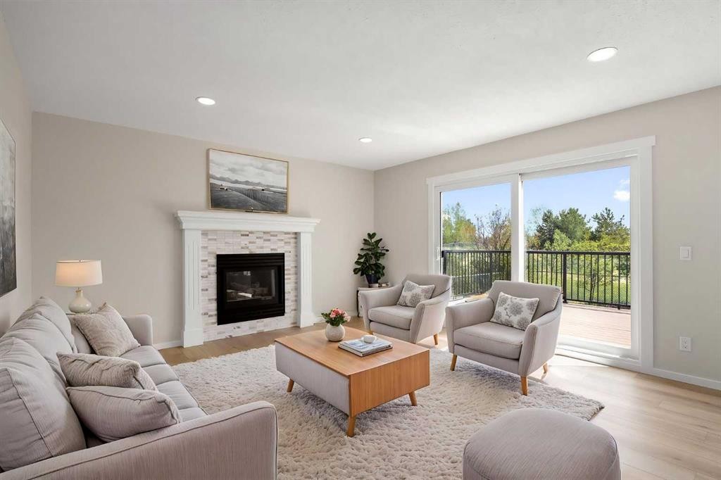 53 Riverview Close, Cochrane, AB - Indoor Photo Showing Living Room With Fireplace