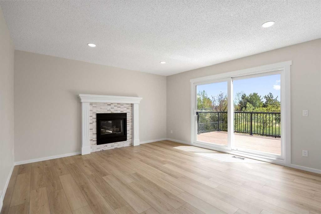 53 Riverview Close, Cochrane, AB - Indoor Photo Showing Living Room With Fireplace
