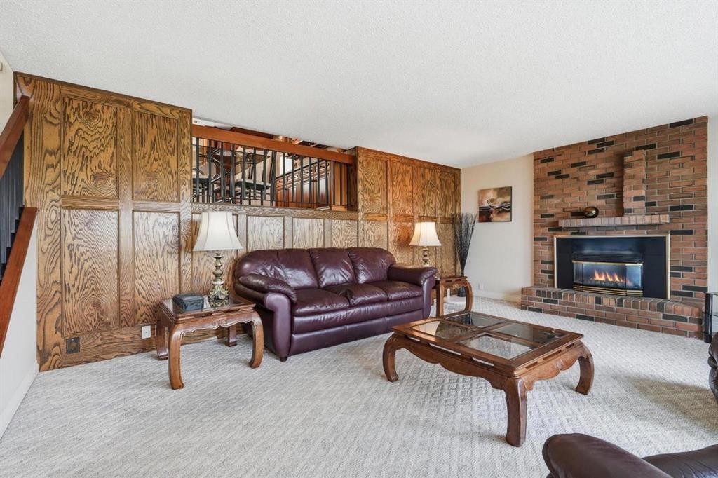 5807 Coach Hill Road Sw, Calgary, AB - Indoor Photo Showing Living Room With Fireplace