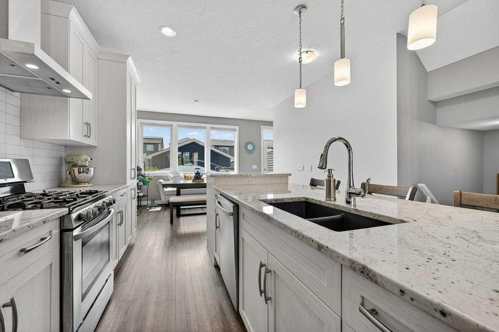 271 Fireside Drive, Cochrane, AB - Indoor Photo Showing Kitchen With Double Sink With Upgraded Kitchen
