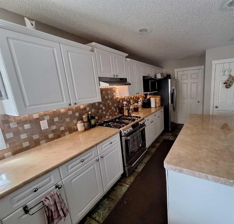 249 West Lakeview Place, Chestermere, AB - Indoor Photo Showing Kitchen With Double Sink