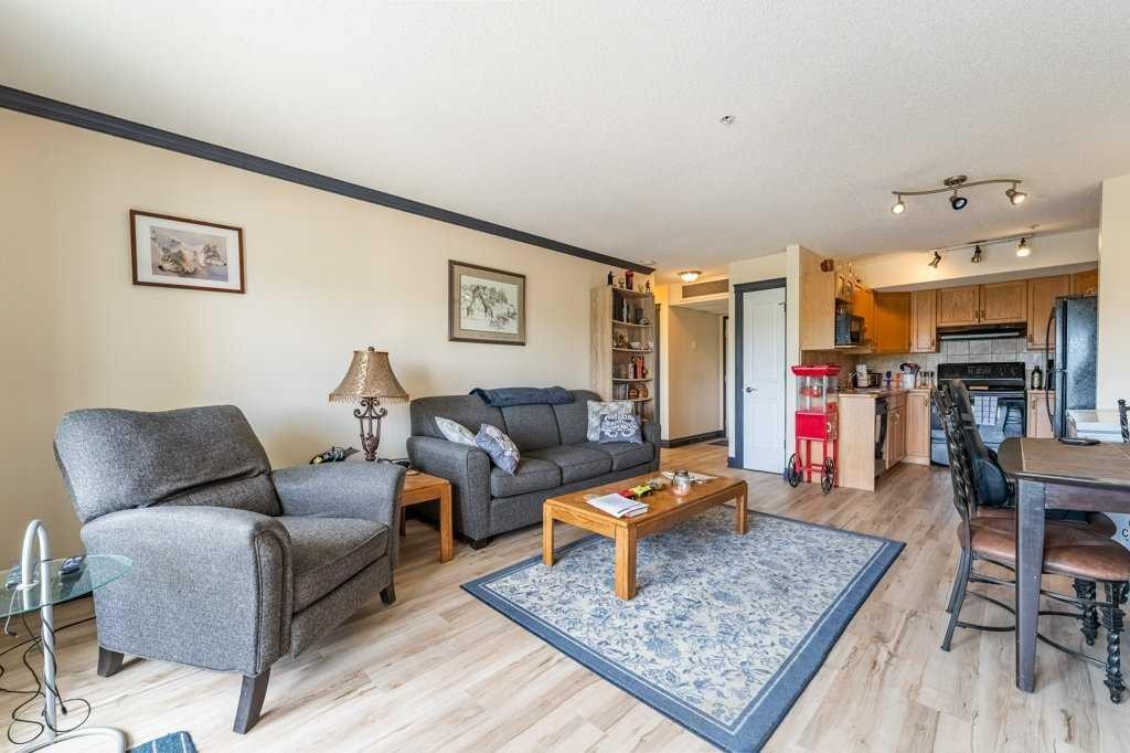 303-300 Edwards Way Nw, Airdrie, AB - Indoor Photo Showing Kitchen With Double Sink