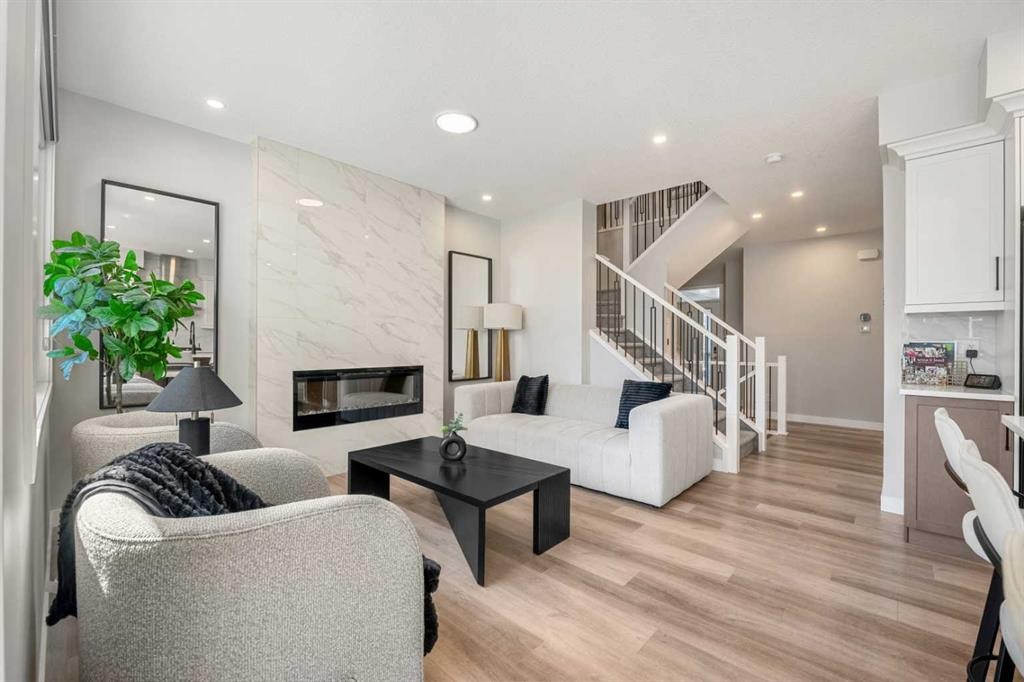 353 Seton Villas Se, Calgary, AB - Indoor Photo Showing Living Room With Fireplace