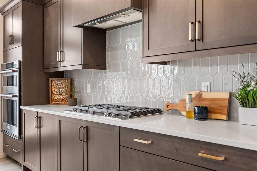 224 Precedence Hill, Cochrane, AB - Indoor Photo Showing Kitchen With Upgraded Kitchen