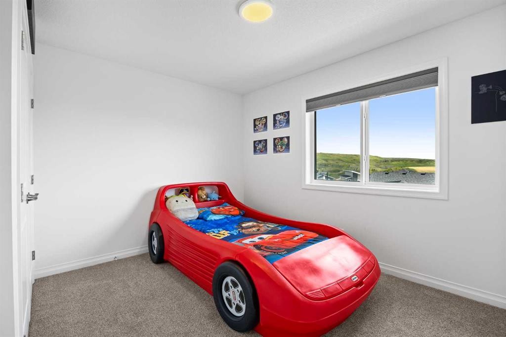 224 Precedence Hill, Cochrane, AB - Indoor Photo Showing Bedroom