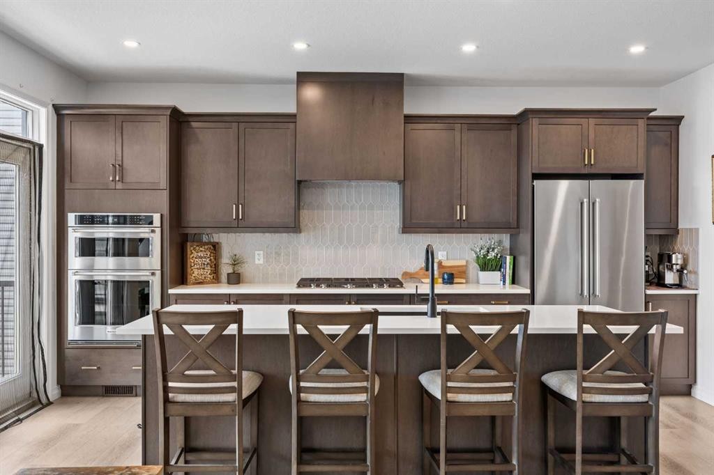 224 Precedence Hill, Cochrane, AB - Indoor Photo Showing Kitchen With Upgraded Kitchen