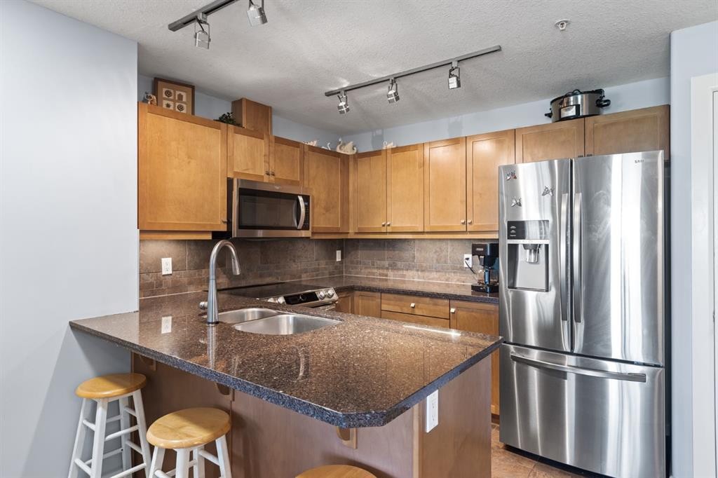 206-30 Cranfield Link Se, Calgary, AB - Indoor Photo Showing Kitchen With Double Sink