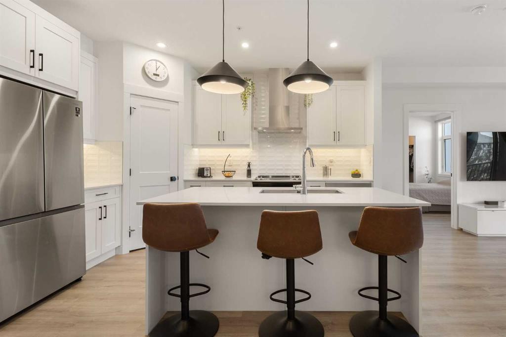 205-10 Sage Hill Walk Nw, Calgary, AB - Indoor Photo Showing Kitchen With Stainless Steel Kitchen With Upgraded Kitchen