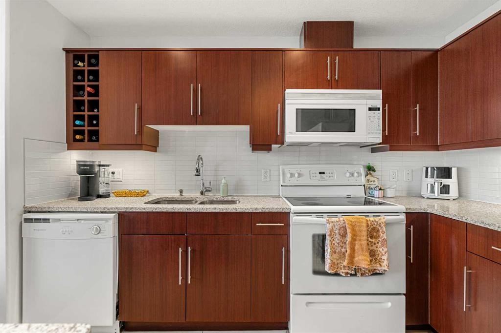 1808-55 Spruce Place Sw, Calgary, AB - Indoor Photo Showing Kitchen With Double Sink