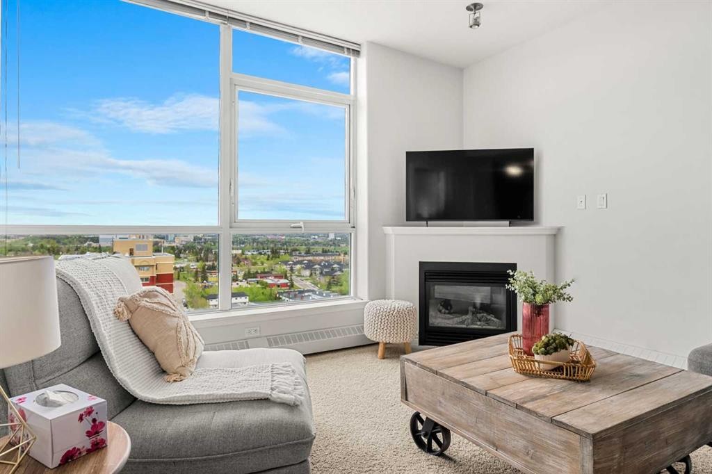 1808-55 Spruce Place Sw, Calgary, AB - Indoor Photo Showing Living Room With Fireplace