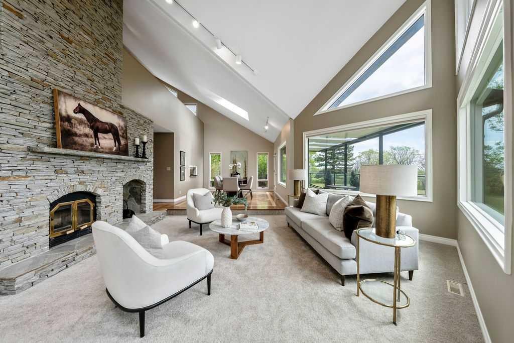 251018 Tower Ridge Estates, Rural Rocky View County, AB - Indoor Photo Showing Living Room With Fireplace