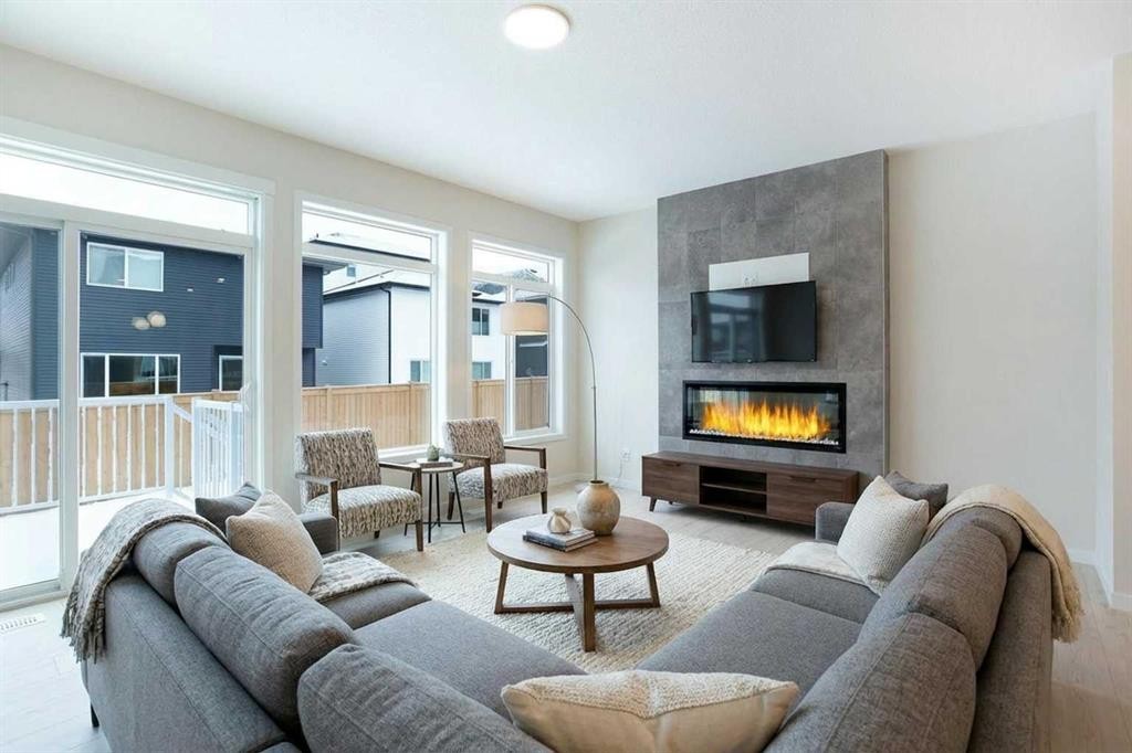 53 Creekside Passage Sw, Calgary, AB - Indoor Photo Showing Living Room With Fireplace