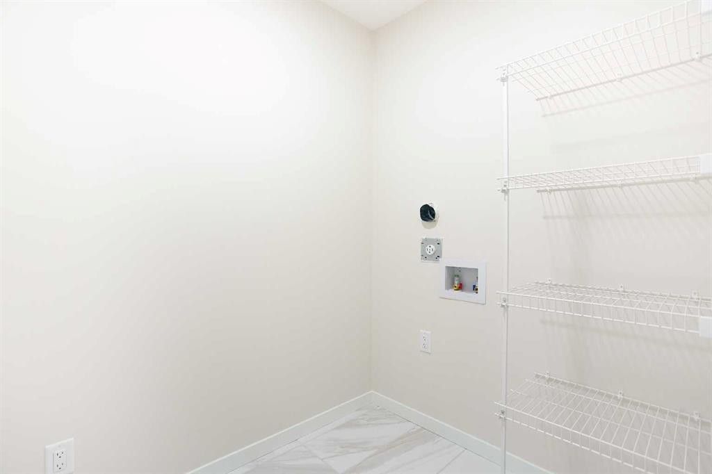 53 Creekside Passage Sw, Calgary, AB - Indoor With Storage