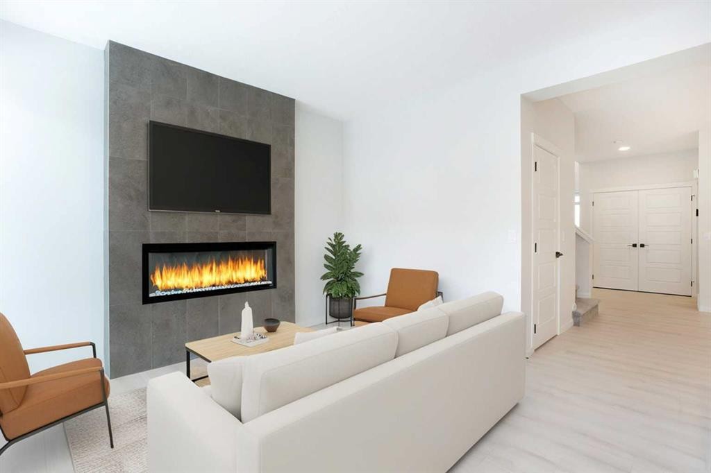 49 Creekside Passage Sw, Calgary, AB - Indoor Photo Showing Living Room With Fireplace