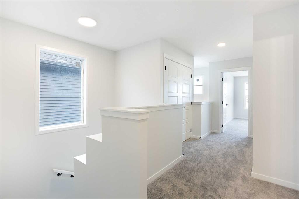 49 Creekside Passage Sw, Calgary, AB - Indoor Photo Showing Other Room